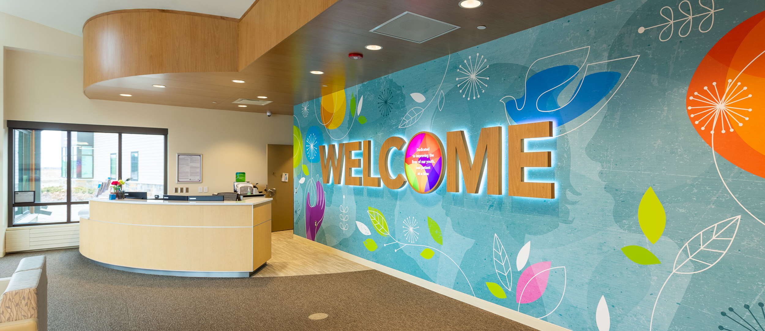 UnityPoint Health Meriter Front Desk Feature Wall LED Back Lit Dimensional Welcome Custom Wallpaper