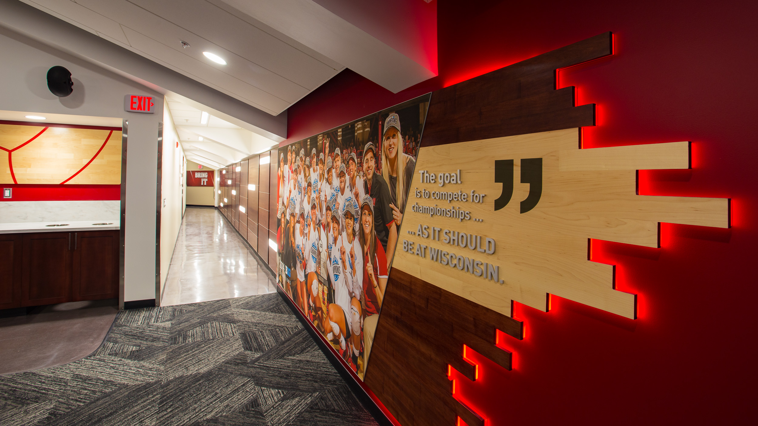 University of Wisconsin - Volleyball Locker Room Feature Wall Backlit Wood Acrylic Lettering Detail Photo