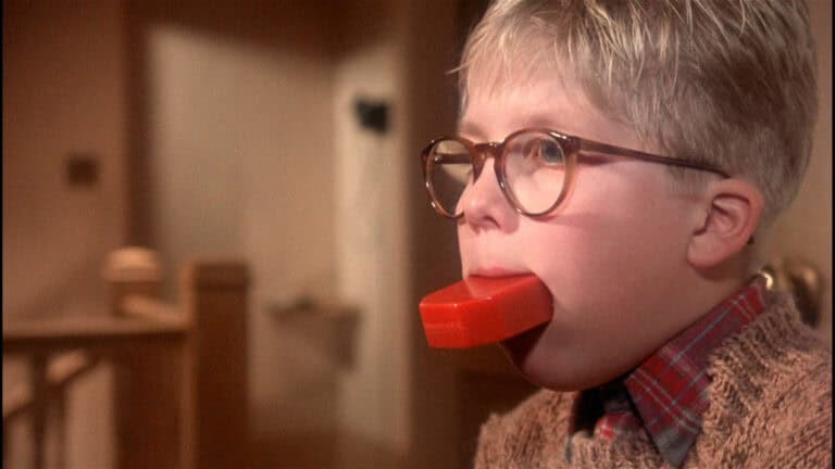 Scene from the movie A Christmas Story with a young boy holding a bar of soap in his mouth as punishment.