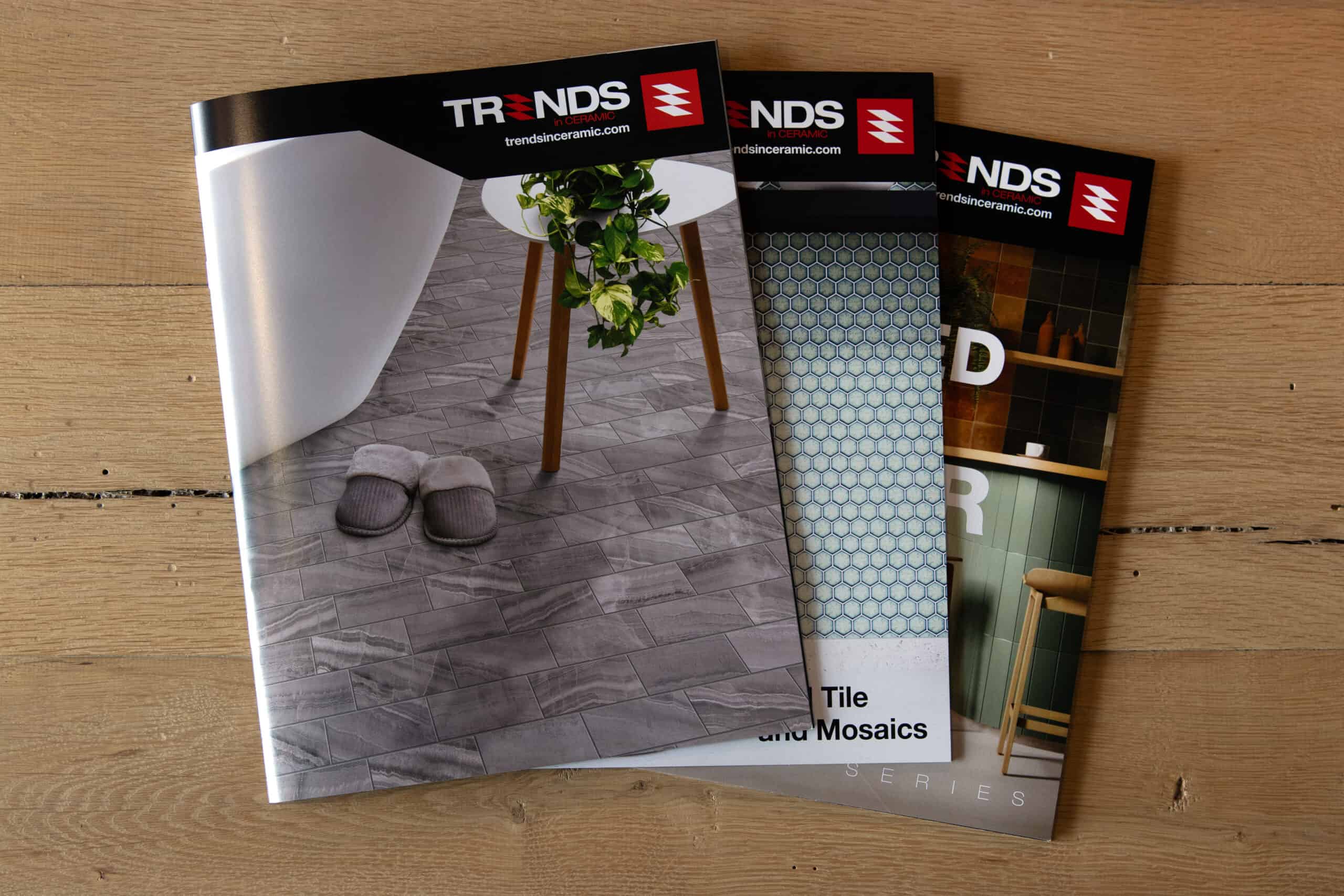 Stack of Trends in Ceramic brochures showcasing tile and mosaic designs, printed with high-quality commercial printing services