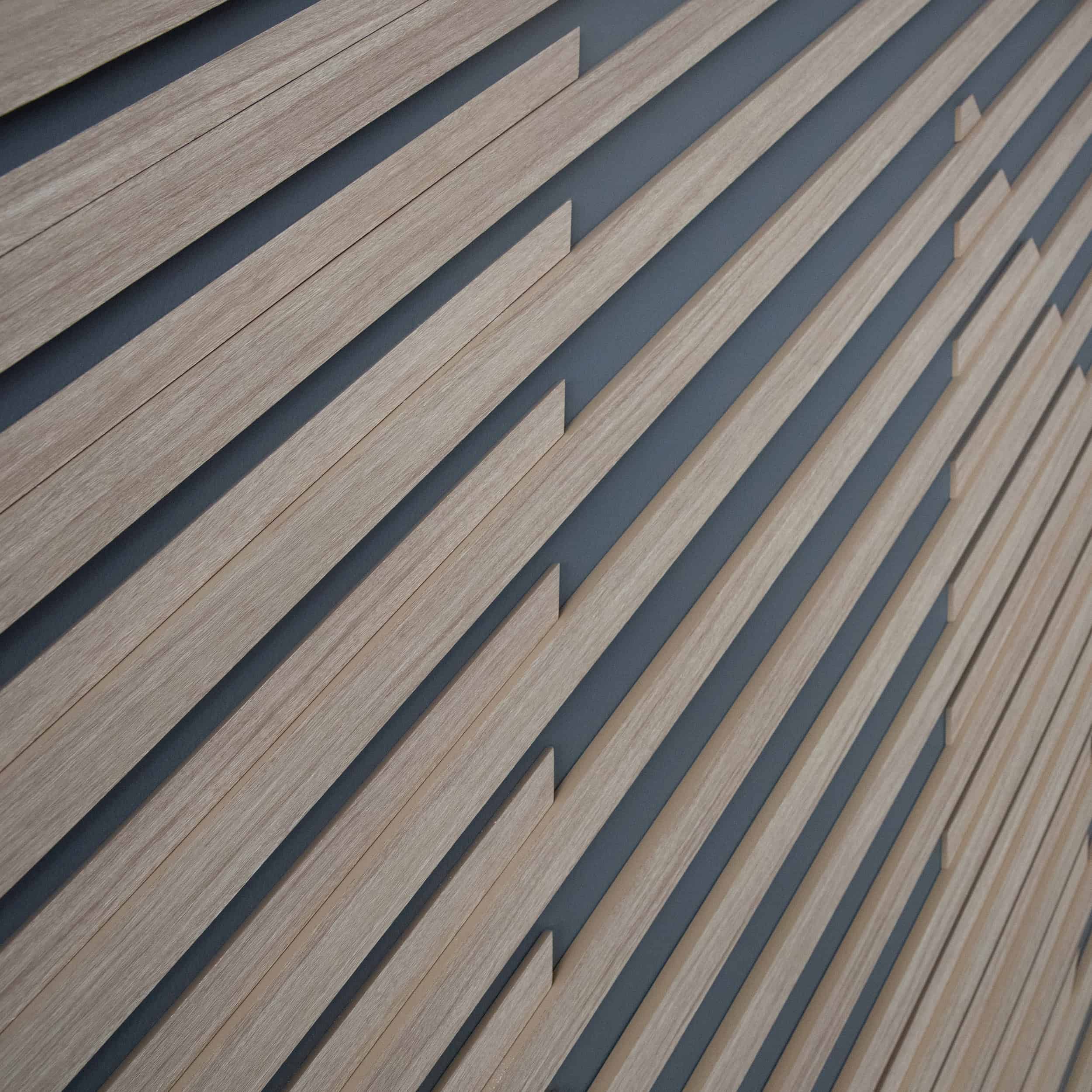 Close-up of wood slat wall installation with diagonal pattern detail at WPS cafeteria.