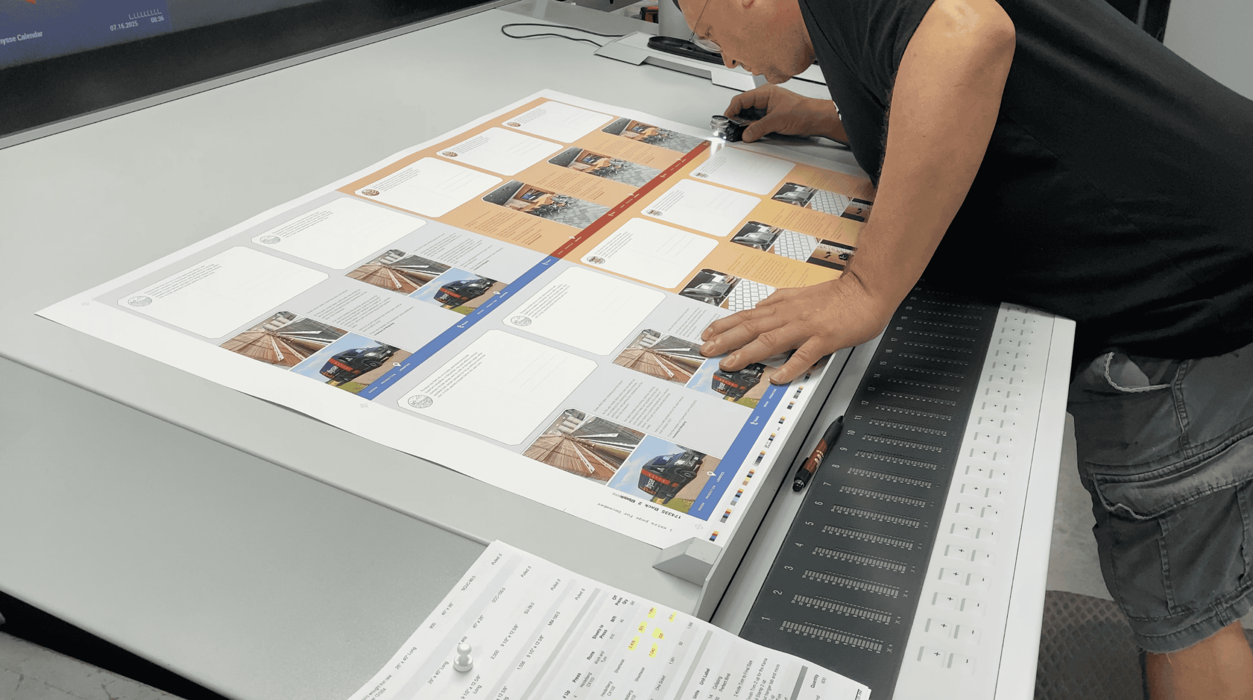 Operator Checking Color Accuracy On Offset Print